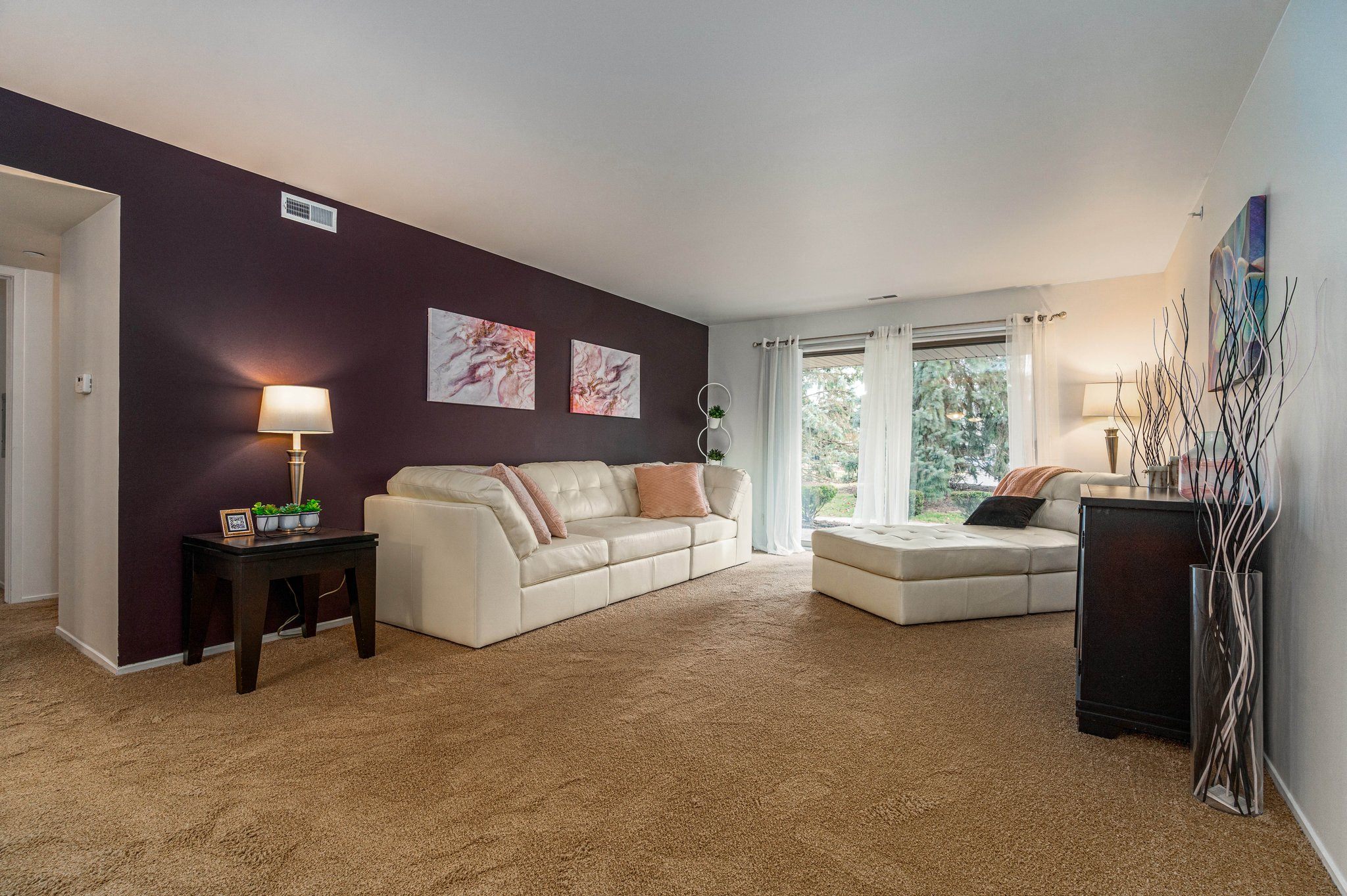 a living room with two couches and a table