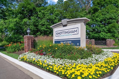 Welcoming entrance at Knottingham Apartments in Clinton Township, MI.