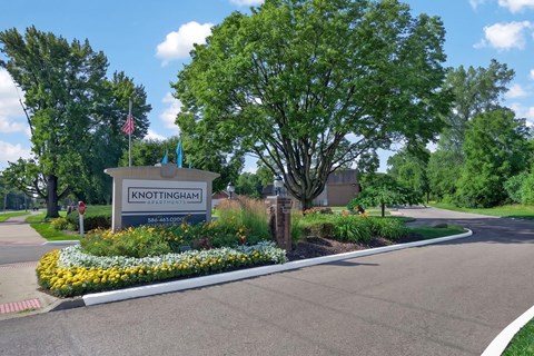 Welcoming entrance at Knottingham Apartments in Clinton Township, MI.