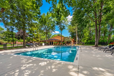 Heated swimming pool with sundeck at Eastwood Village Apartments in Clinton Township, MI.