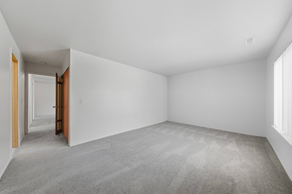Comfortable Bedroom with natural light at Franklin River Apartments in Southfield, MI