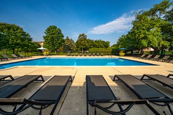 Heated swimming pool with sundeck at Dover Hills Apartments in Kalamazoo, MI.