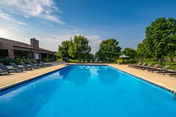 Heated swimming pool with sundeck at Dover Hills Apartments in Kalamazoo, MI.