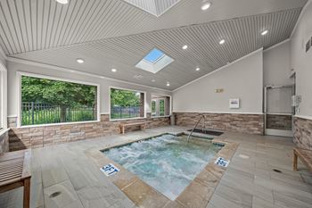 Indoor hot tub with skylight at Dover Hills Apartments in Kalamazoo, MI.