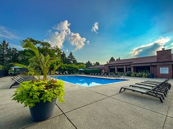 Heated swimming pool with sundeck at Dover Hills Apartments in Kalamazoo, MI.