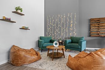 Spacious community clubhouse with lounge and kitchen at Dover Hills Apartments in Kalamazoo, MI.