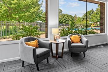 Spacious community clubhouse with lounge and kitchen at Dover Hills Apartments in Kalamazoo, MI.