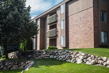 Exterior building with trees in courtyard at Dover Hills Apartments in Kalamazoo, MI - Photo Gallery 2