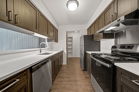 Modern kitchen with stainless steel appliances at Franklin River Apartments in Southfield, MI