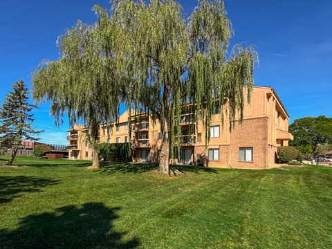 Expansive Green Space Apartment Building Exterior at Franklin River Apartments, Southfield, MI