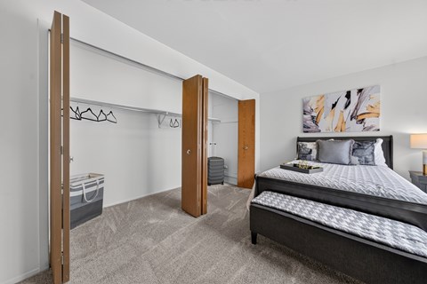 Bedroom with ample storage space at Franklin River Apartments in Southfield, MI.