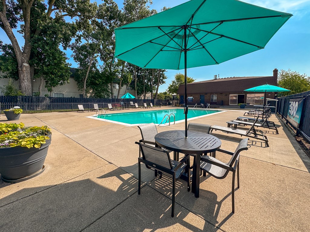 Heated pool and fenced in sundeck at Knottingham Apartments in Clinton Township, MI.