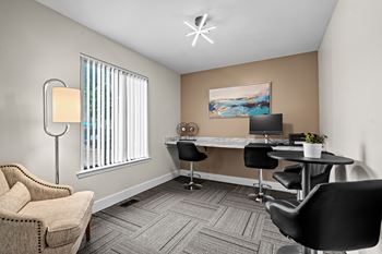 Clubhouse with coworking lounge at Knottingham Apartments in Clinton Township, MI.