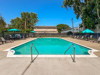 Heated swimming pool with sundeck at Knottingham Apartments in Clinton Township, MI.