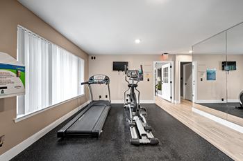 Updated 24-hour fitness and wellness center at Knottingham Apartments in Clinton Township, MI.
