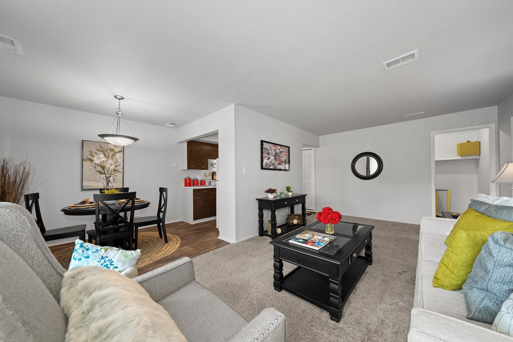 Open and airy living room with natural lighting at Knottingham Apartments in Clinton Township, MI.
