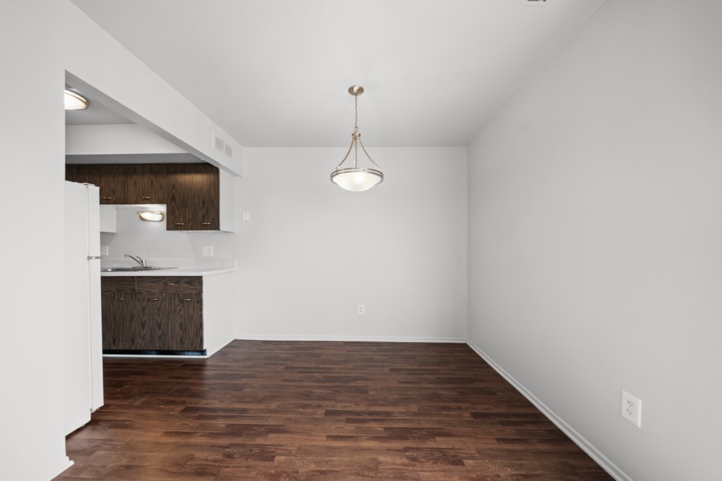 Spacious dining room area ta Knottingham Apartments in Clinton Township, MI.