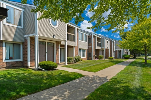 Private-Entry apartment buildings in Southfield with a walkway and sidewalk.
