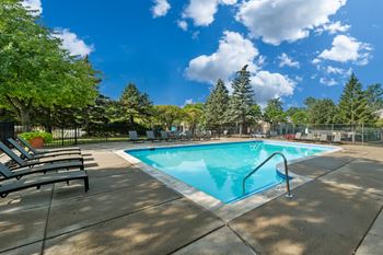 Heated swimming pool with sundeck at Park Lane Apartments in Southfield, MI.