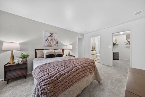 Cozy bedroom with bathroom and ample storage at Park Lane Apartments in Southfield, MI.