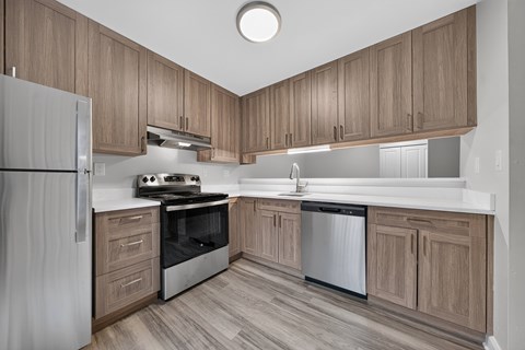 Stainless steel appliances and soft-close cabinets at Park Lane Apartments in Southfield, MI.