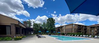 Expansive sundeck at heated pool at Lakeside Village Apartments Clinton Township MI 48038