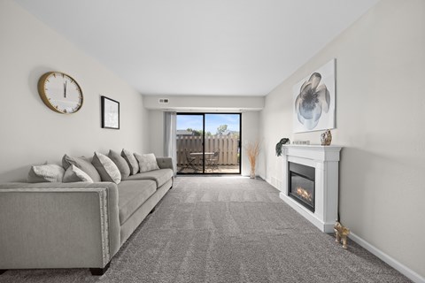 Living Room with Natural lighting  at Three Oaks Apartments in Troy, MI