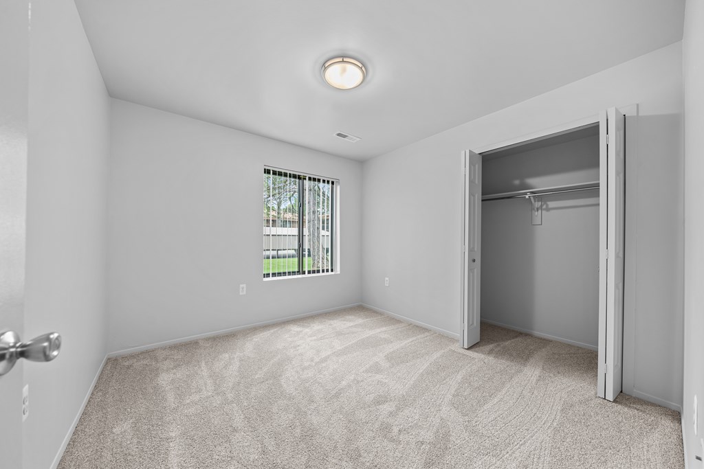 Big bedroom with natural lighting at Westwood Village Apartments in Westland, MI