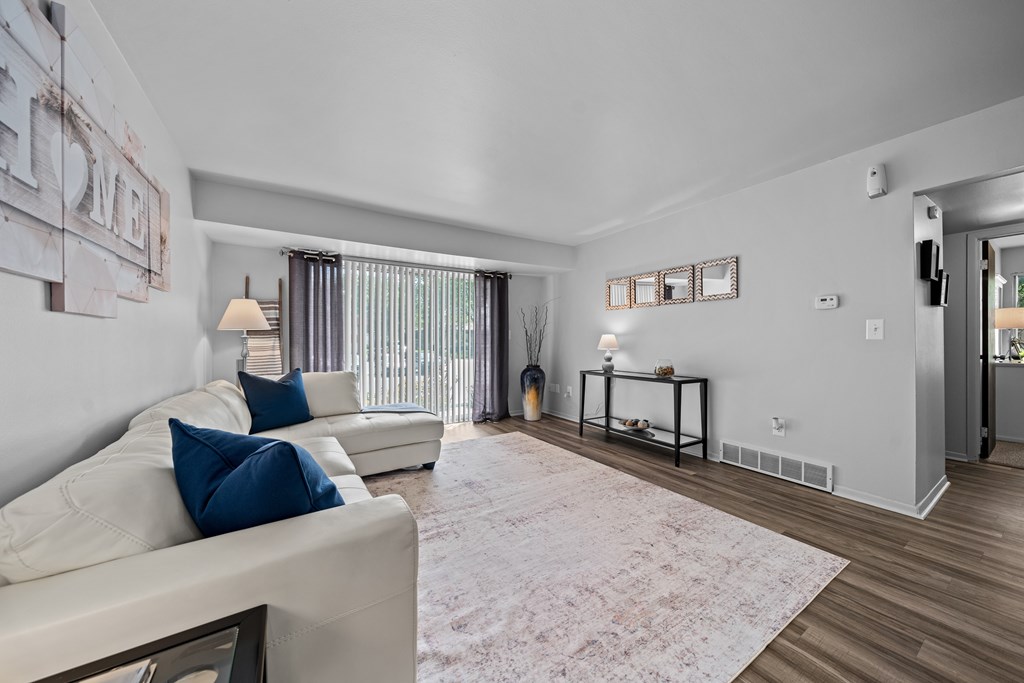 Spacious living room with natural light at Westwood Village Apartments in Westland, MI