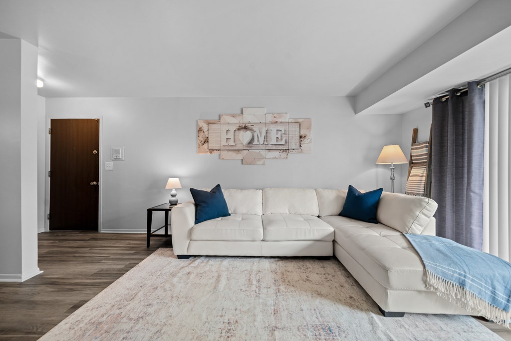 Spacious living room with natural light at Westwood Village Apartments in Westland, MI