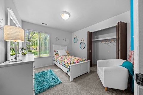 Bedroom with natural lighting at Westwood Village Apartments in Westland, MI