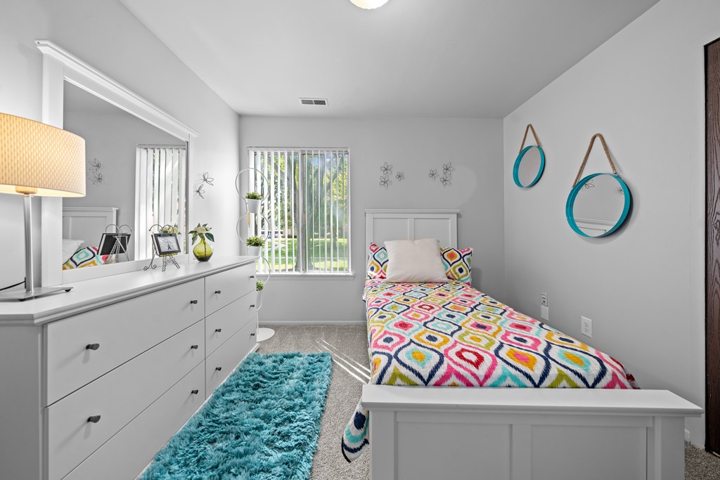 Bedroom with natural lighting at Westwood Village Apartments in Westland, MI