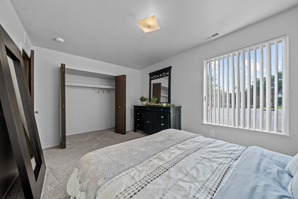 Big bedroom with natural lighting at Westwood Village Apartments in Westland, MI