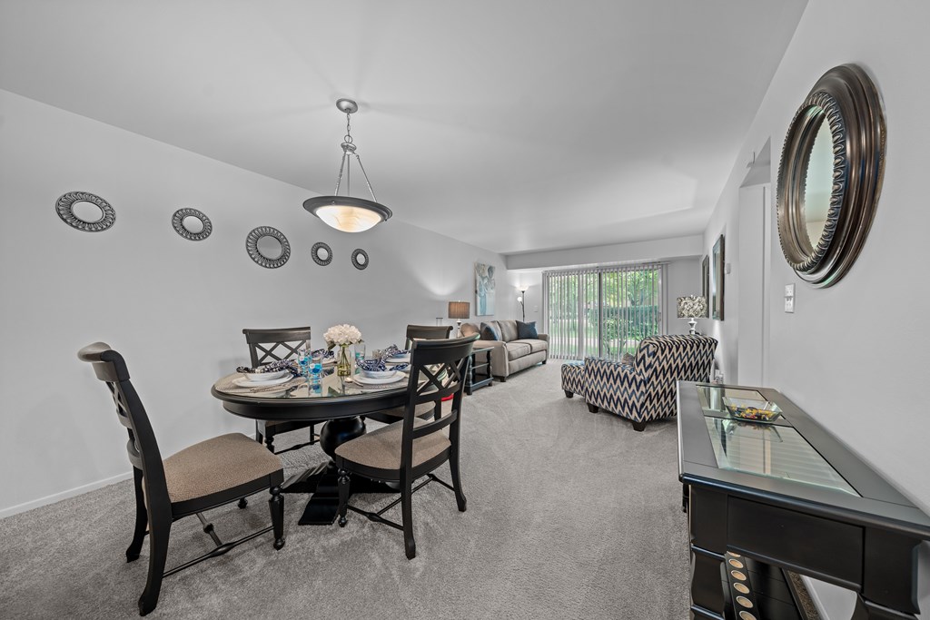 Spacious living/dining room with natural light at Westwood Village Apartments in Westland, MI