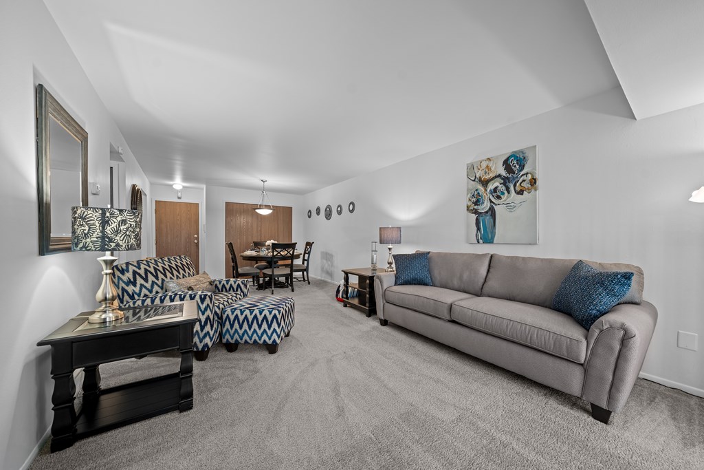 Spacious living room with natural light at Westwood Village Apartments in Westland, MI