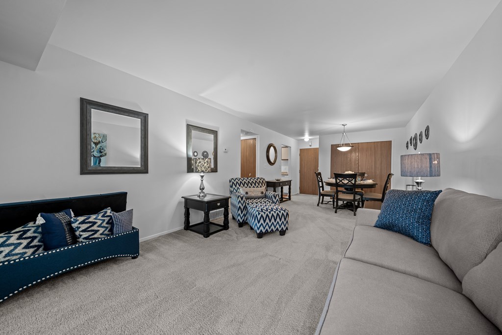 Spacious living room with natural light at Westwood Village Apartments in Westland, MI