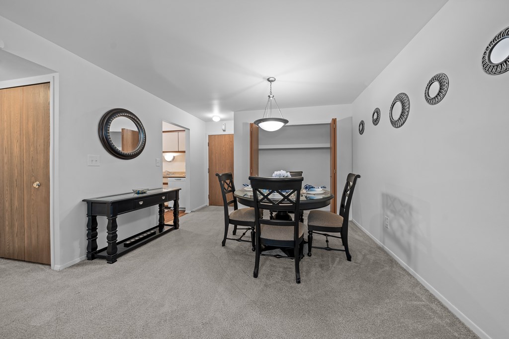 Cozy dining room connected to kitchen at Westwood Village Apartments in Westland, MI