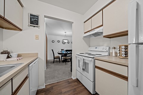 Cozy dining room connected to kitchen at Westwood Village Apartments in Westland, MI