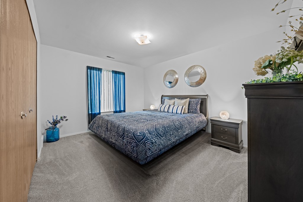 Cozy bedroom with natural light at Westwood Village Apartments in Westland, MI