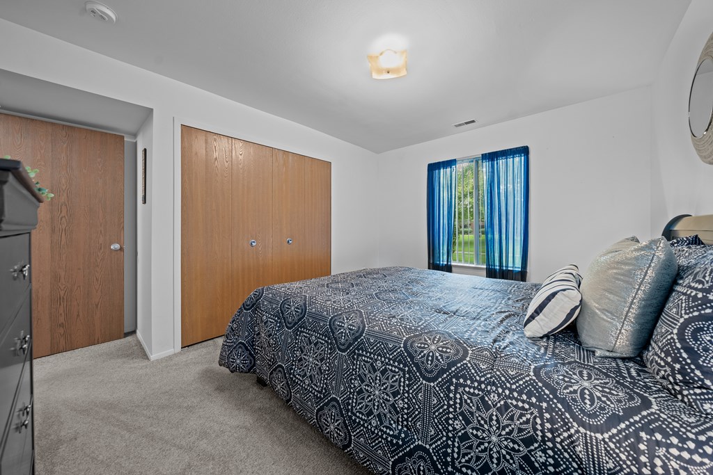 Spacious bedroom at Westwood Village Apartments in Westland, MI