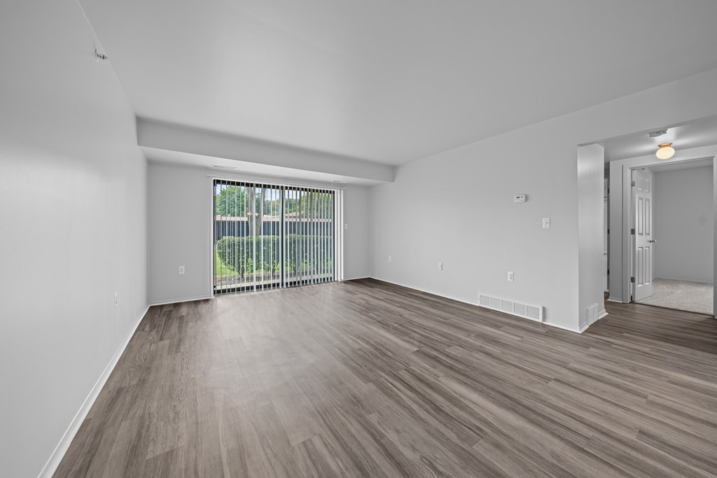 Spacious living room with natural light at Westwood Village Apartments in Westland, MI
