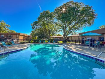 Two heated pools with sundecks at Westwood Village Apartments in Westland, MI.