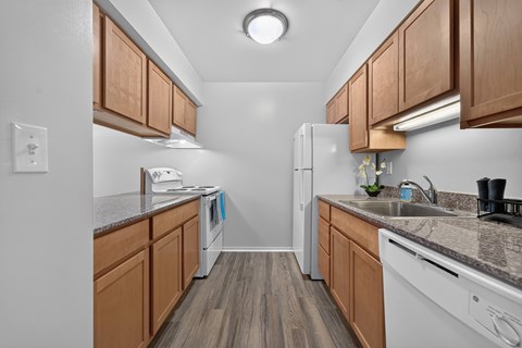 Efficient kitchen at Woodland Villa Apartments in Westland, MI.