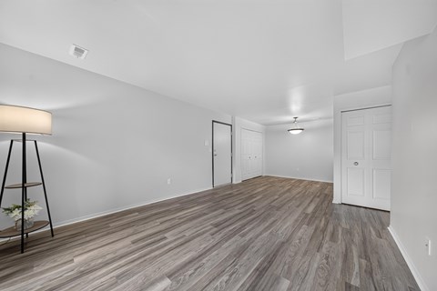 Spacious living and dining room at Woodland Villa Apartments in Westland, MI.