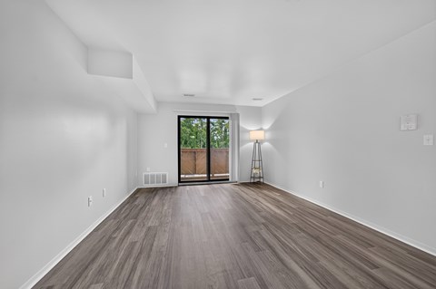 Spacious living room at Woodland Villa Apartments in Westland, MI.