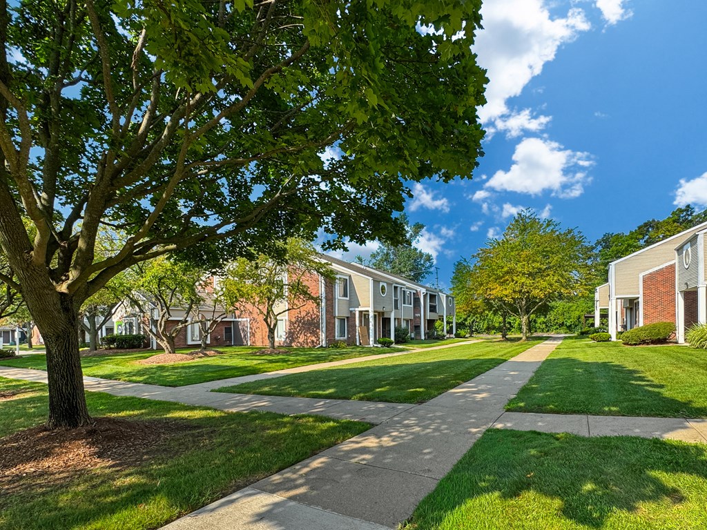 Private-Entry apartment buildings in Southfield with a walkway and sidewalk.
