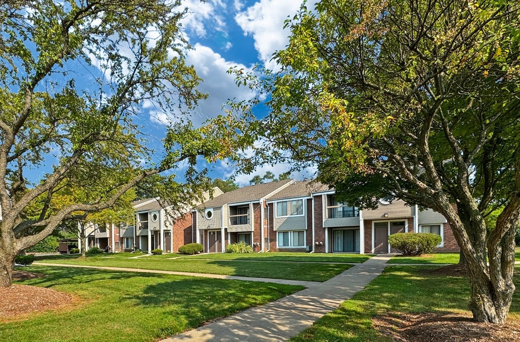 Private-Entry apartment buildings in Southfield with a walkway and sidewalk.