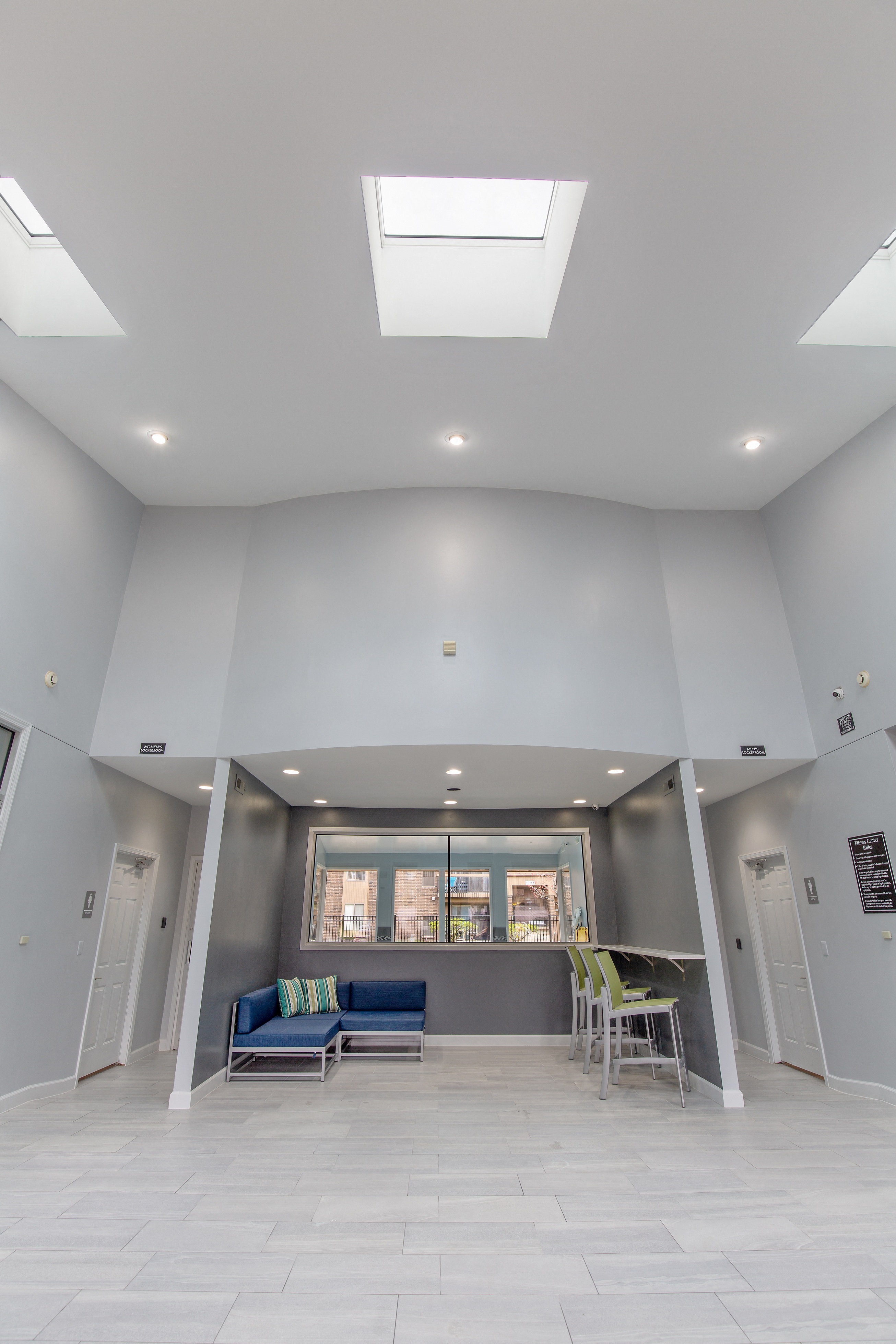 a living room with a couch and a table and a window