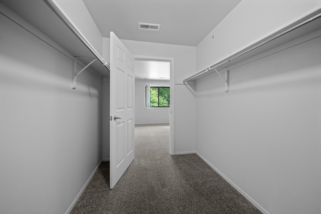 Spacious bedroom closet for ample storage at Woodland Villa Apartments in Westland, MI.