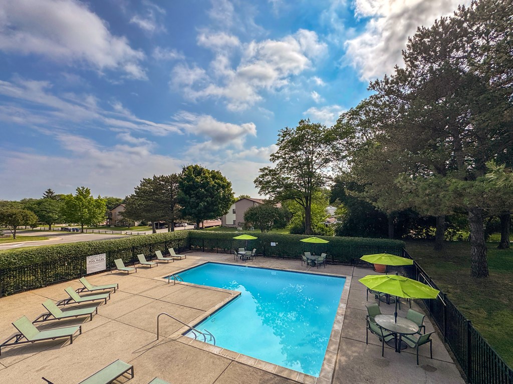 Pool with sundeck at Woodland Villa Apartments in Westland, MI.